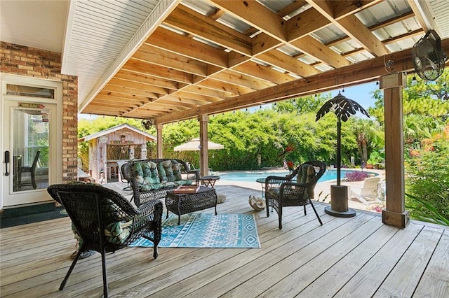 8 Oak Tree Dr, Slidell, LA 70458 - wooden deck with an outdoor pool, an outdoor living space, and an outbuilding