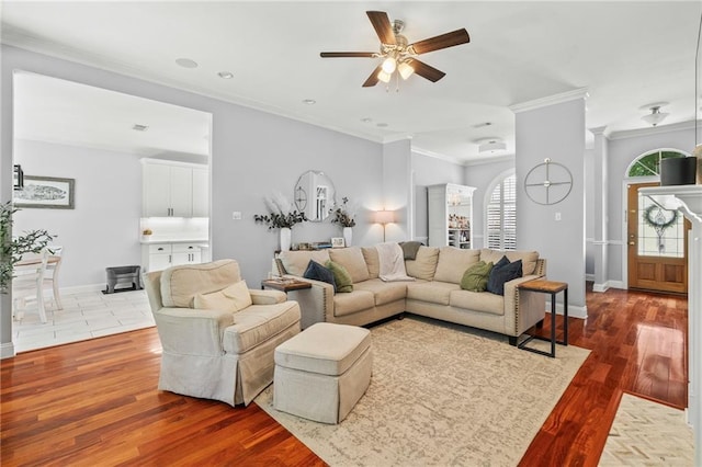 1107 Meadow Ct, Mandeville, LA 70448 - living room with ceiling fan, ornamental molding, wood finished floors, and recessed lighting