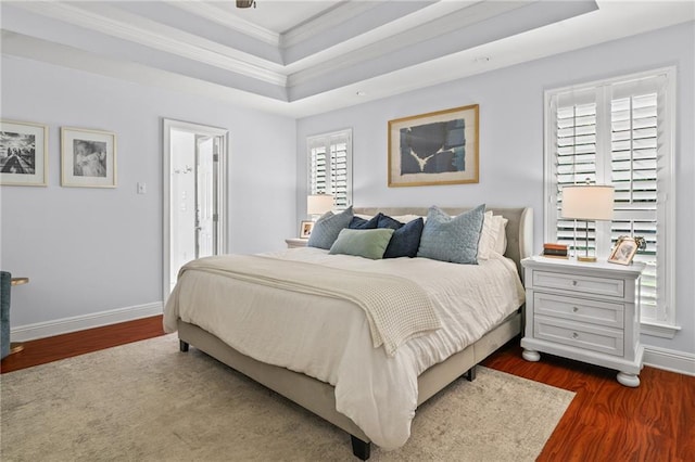 1107 Meadow Ct, Mandeville, LA 70448 - bedroom with a raised ceiling, ornamental molding, and dark wood-type flooring
