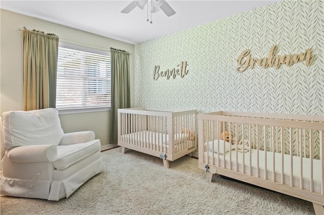 1107 Meadow Ct, Mandeville, LA 70448 - carpeted bedroom featuring wallpapered walls, a ceiling fan, and a nursery area