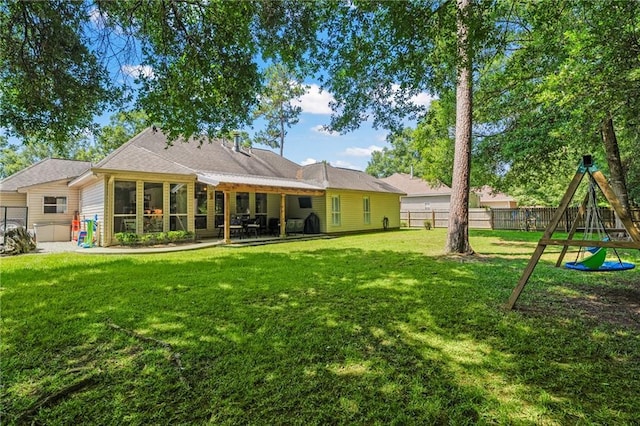 1107 Meadow Ct, Mandeville, LA 70448 - back of house with a fenced backyard, a playground, and a patio area