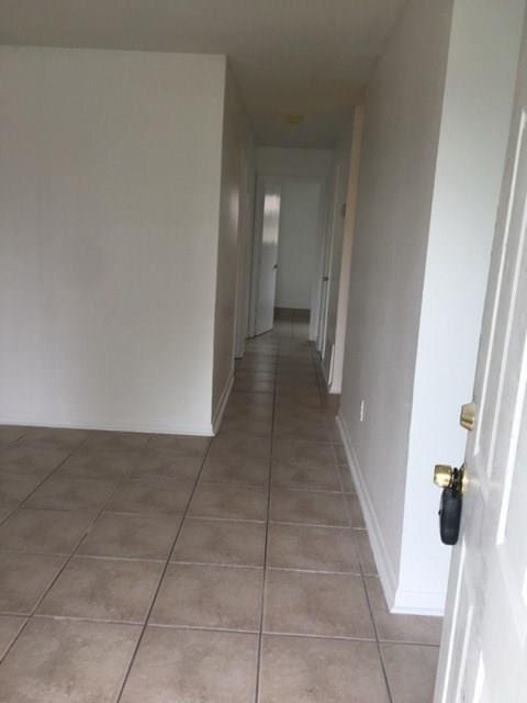 520 Emile Ave, Westwego, LA 70094 - hallway with light tile patterned floors