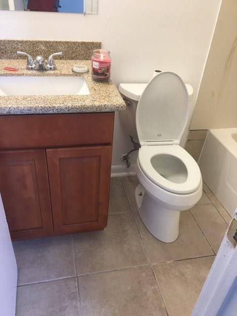 520 Emile Ave, Westwego, LA 70094 - bathroom featuring vanity and tile patterned flooring