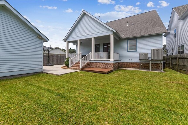 230 26th St, New Orleans, LA 70124 - back of house with roof with shingles and a patio