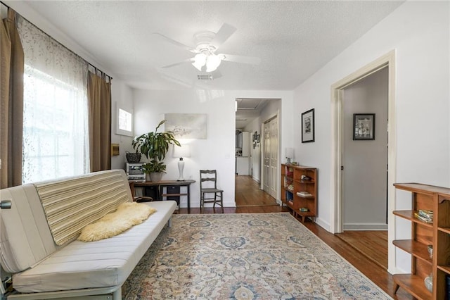 2816 Berwick St, Jefferson, LA 70121 - living area featuring a ceiling fan, wood finished floors, and a textured ceiling