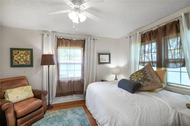 2816 Berwick St, Jefferson, LA 70121 - bedroom featuring a textured ceiling, wood finished floors, and a ceiling fan