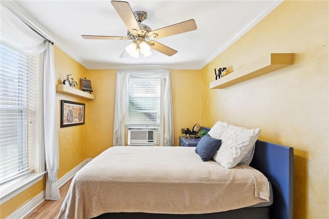257 Cherokee St Unit 3, New Orleans, LA 70118 - bedroom featuring cooling unit, wood finished floors, ornamental molding, and ceiling fan