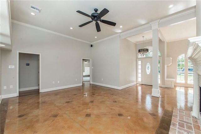 2212 Prairie Ct, Mandeville, LA 70448 - unfurnished room featuring a towering ceiling, a ceiling fan, crown molding, ornate columns, and recessed lighting