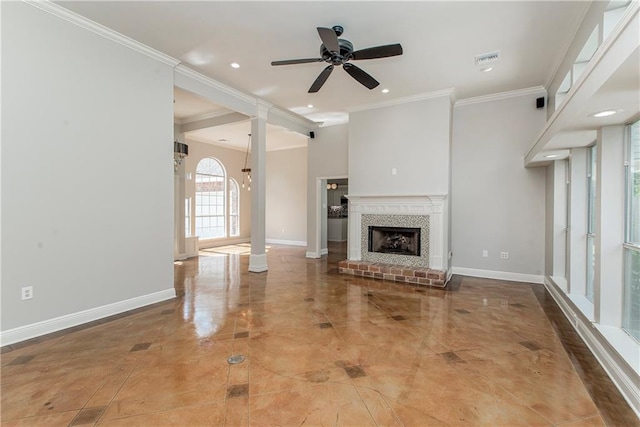 2212 Prairie Ct, Mandeville, LA 70448 - unfurnished living room with ceiling fan, crown molding, a fireplace, recessed lighting, and ornate columns