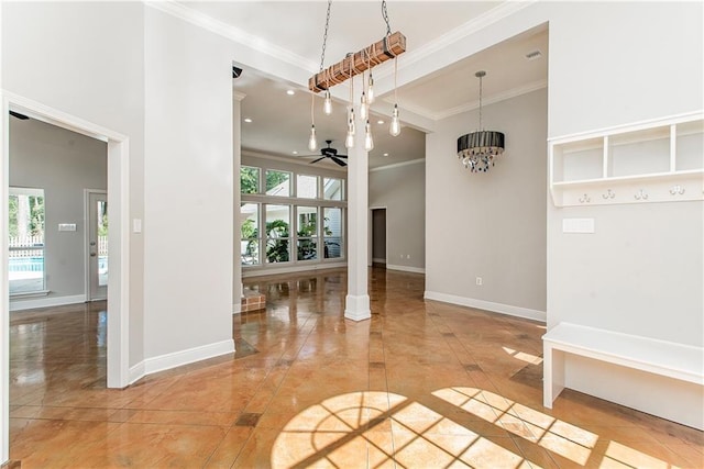 2212 Prairie Ct, Mandeville, LA 70448 - spare room with a ceiling fan, ornamental molding, a chandelier, and inlaid floor details