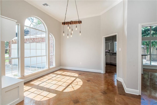2212 Prairie Ct, Mandeville, LA 70448 - unfurnished dining area with ornamental molding, finished concrete flooring, and a towering ceiling