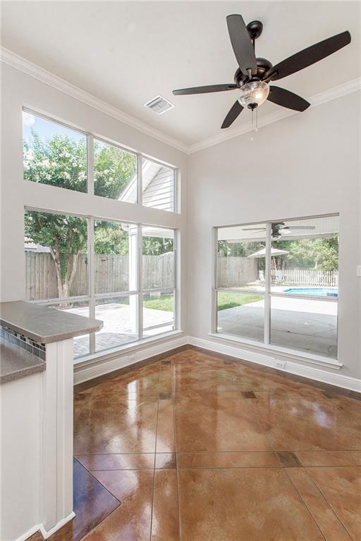 2212 Prairie Ct, Mandeville, LA 70448 - spare room with ornamental molding, a ceiling fan, and tile patterned floors