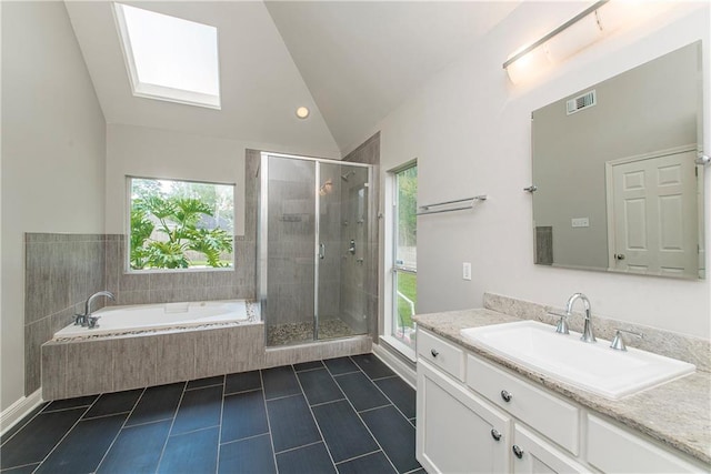 2212 Prairie Ct, Mandeville, LA 70448 - bathroom featuring vanity, tile patterned floors, healthy amount of natural light, a garden tub, and high vaulted ceiling