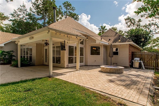 2212 Prairie Ct, Mandeville, LA 70448 - rear view of property featuring an outdoor fire pit, a patio, a shingled roof, and ceiling fan