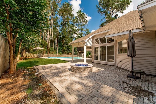 2212 Prairie Ct, Mandeville, LA 70448 - fenced backyard with a patio and an outdoor fire pit