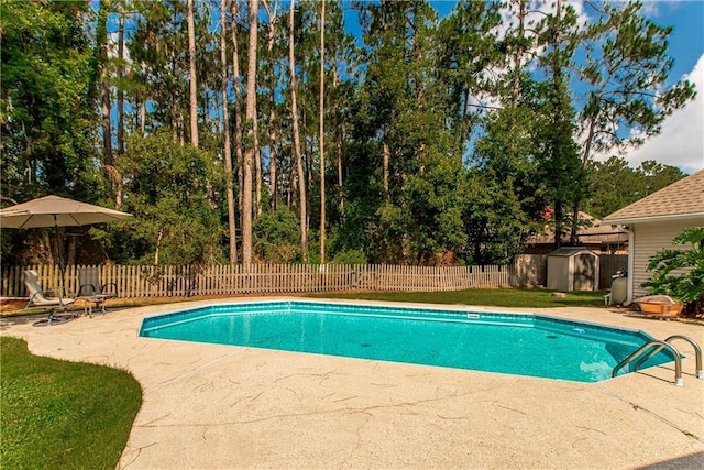 2212 Prairie Ct, Mandeville, LA 70448 - view of pool with a storage shed, a patio, a fenced backyard, and view of scattered trees