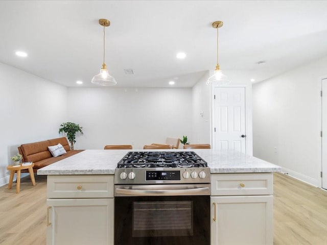 1340 Nursery Pl, Metairie, LA 70005 - kitchen featuring stainless steel gas range oven, light wood-type flooring, decorative light fixtures, white cabinets, and recessed lighting