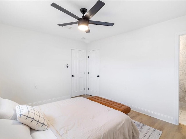 1340 Nursery Pl, Metairie, LA 70005 - bedroom with light wood-style flooring, ceiling fan, and ensuite bathroom