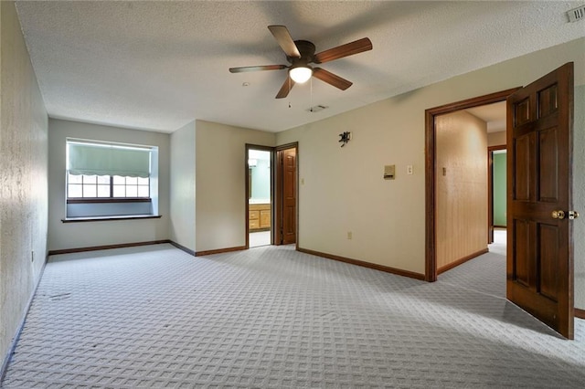 3541 Alan St, Metairie, LA 70002 - empty room with light carpet, ceiling fan, and a textured ceiling
