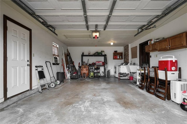 3541 Alan St, Metairie, LA 70002 - garage featuring a garage door opener and washing machine and clothes dryer