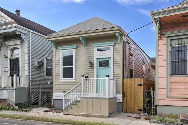 2272 N Robertson St, New Orleans, LA 70117 - shotgun-style home with a gate and a wall mounted AC