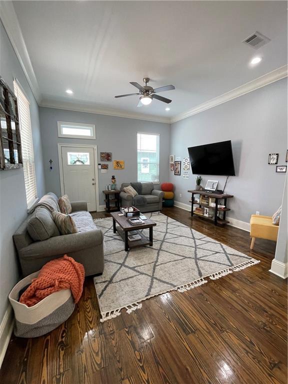 2272 N Robertson St, New Orleans, LA 70117 - living room with wood finished floors, ceiling fan, crown molding, and recessed lighting
