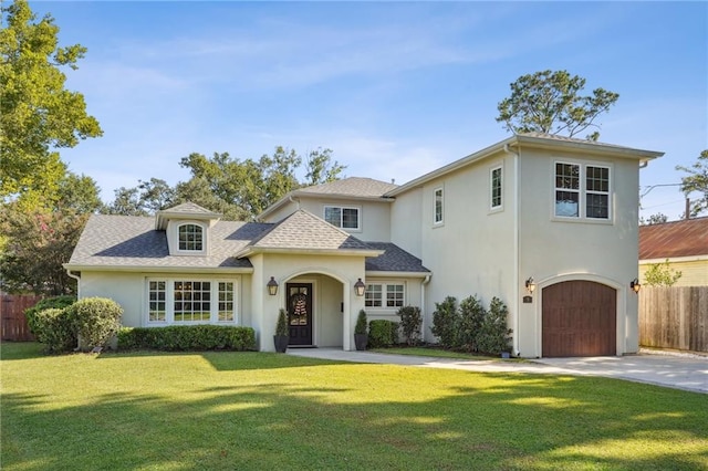 9 Hennessey Ct, River Ridge, LA 70123 - view of front of house with stucco siding, an attached garage, concrete driveway, and roof with shingles