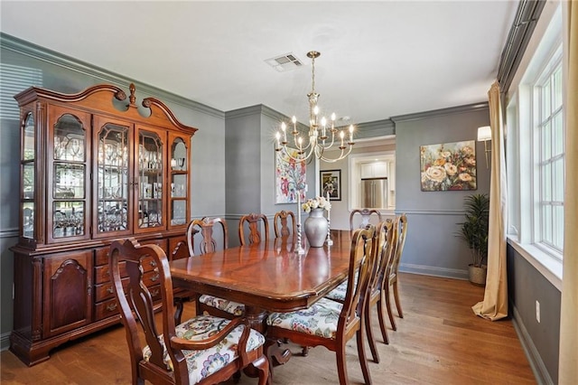9 Hennessey Ct, River Ridge, LA 70123 - dining room featuring a chandelier, ornamental molding, and wood finished floors