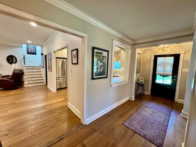 9 Hennessey Ct, River Ridge, LA 70123 - entryway with crown molding, stairway, and wood finished floors