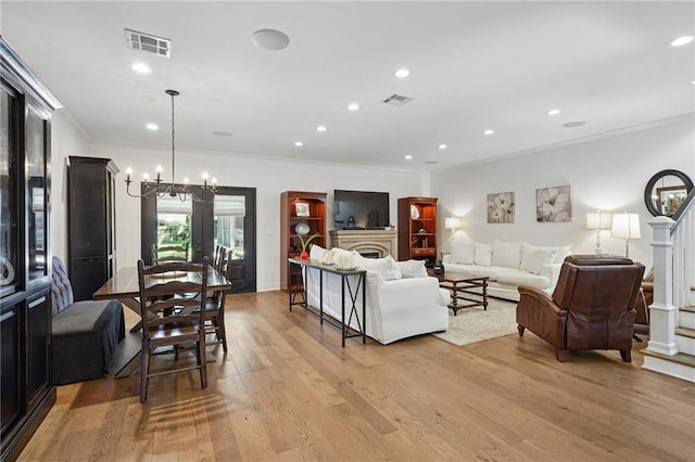 9 Hennessey Ct, River Ridge, LA 70123 - living room featuring crown molding, light wood-style floors, a chandelier, and recessed lighting