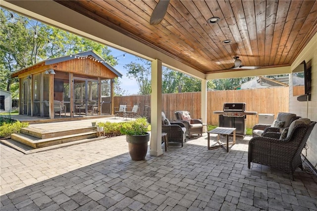 9 Hennessey Ct, River Ridge, LA 70123 - fenced backyard featuring a sunroom, a patio area, area for grilling, outdoor lounge area, and ceiling fan