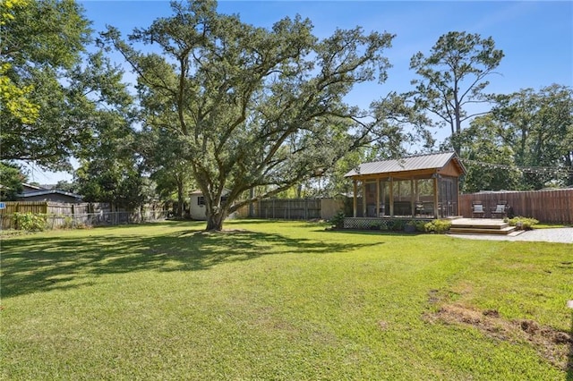 9 Hennessey Ct, River Ridge, LA 70123 - fenced backyard with a deck and an outbuilding