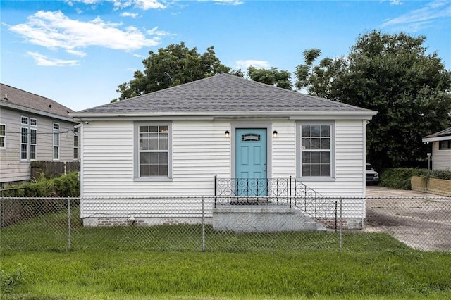 7922 Flounder St, New Orleans, LA 70126 - view of front of house featuring a fenced front yard and roof with shingles