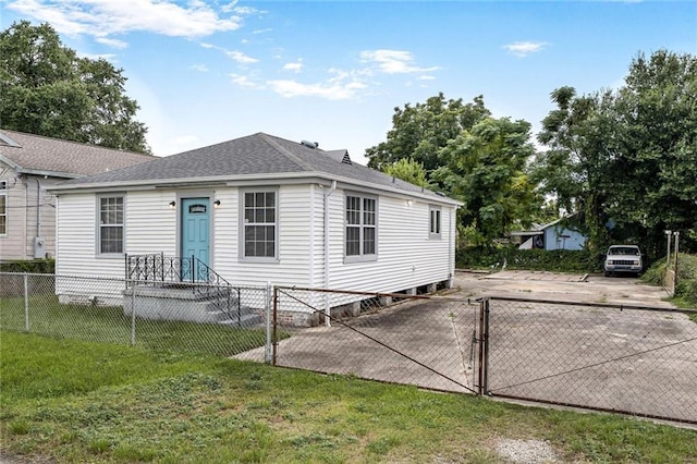 7922 Flounder St, New Orleans, LA 70126 - view of front of house featuring a fenced front yard, roof with shingles, and a gate