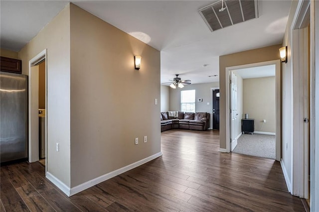 7922 Flounder St, New Orleans, LA 70126 - hallway with dark wood-style floors and baseboards