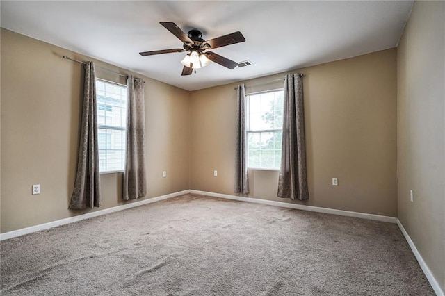 7922 Flounder St, New Orleans, LA 70126 - unfurnished room with plenty of natural light, a ceiling fan, and carpet flooring