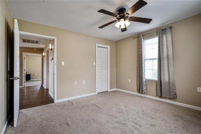 7922 Flounder St, New Orleans, LA 70126 - unfurnished bedroom with attic access, carpet, a closet, and a ceiling fan