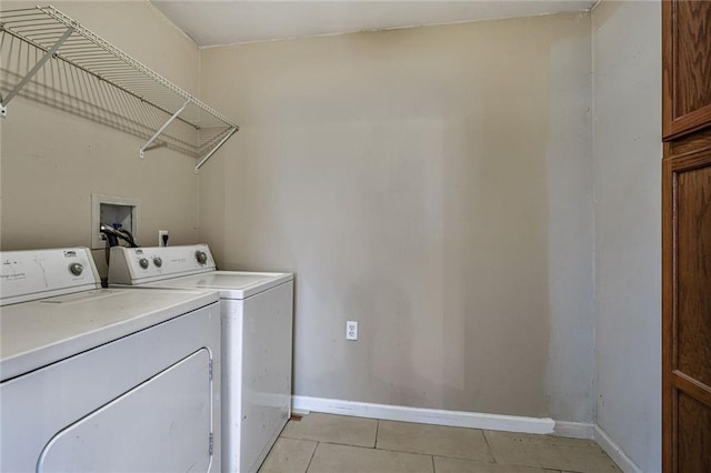 7922 Flounder St, New Orleans, LA 70126 - laundry room with washing machine and dryer and light tile patterned floors