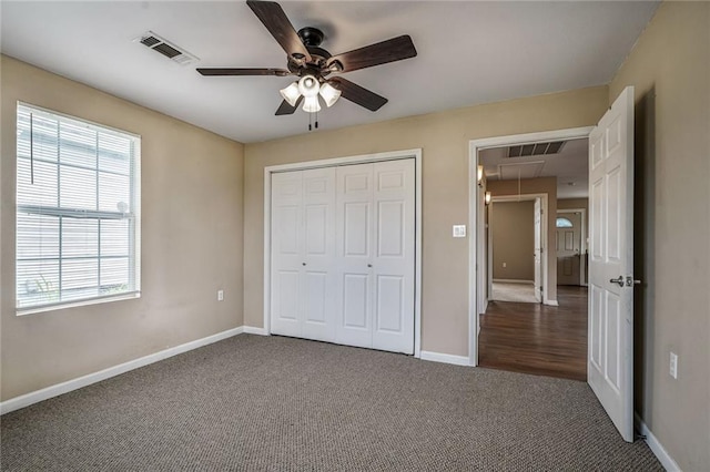 7922 Flounder St, New Orleans, LA 70126 - unfurnished bedroom with attic access, carpet, a closet, and ceiling fan