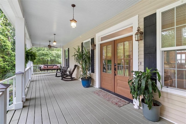 28 Hyacinth Dr, Covington, LA 70433 - wooden porch with french doors and ceiling fan