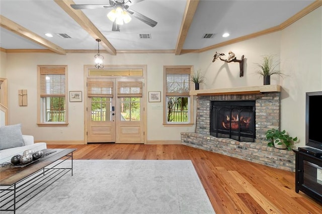 28 Hyacinth Dr, Covington, LA 70433 - unfurnished living room featuring wood finished floors, beam ceiling, a ceiling fan, a brick fireplace, and crown molding
