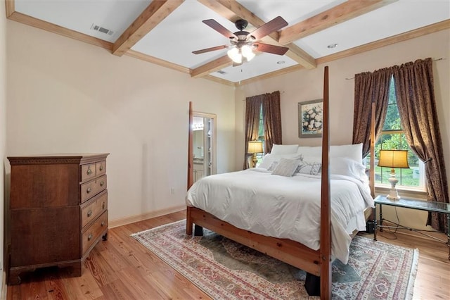 28 Hyacinth Dr, Covington, LA 70433 - bedroom with light wood finished floors, beamed ceiling, ensuite bath, and a ceiling fan