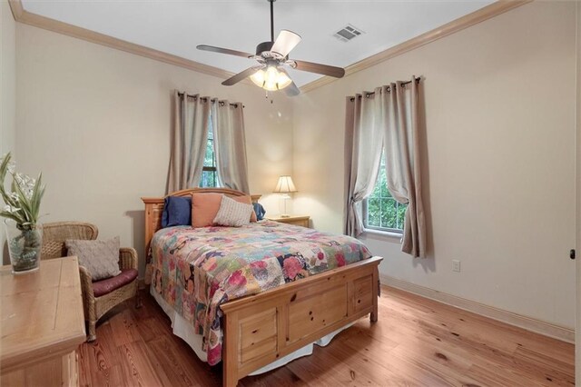 28 Hyacinth Dr, Covington, LA 70433 - bedroom with ornamental molding, light wood-type flooring, and a ceiling fan