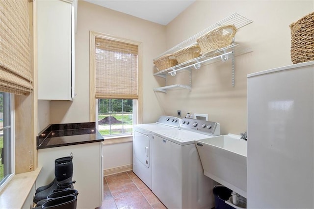 28 Hyacinth Dr, Covington, LA 70433 - washroom with independent washer and dryer, cabinet space, and light tile patterned floors