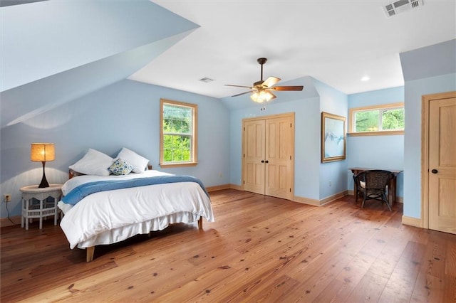 28 Hyacinth Dr, Covington, LA 70433 - bedroom featuring light wood-type flooring, multiple windows, vaulted ceiling, a ceiling fan, and recessed lighting