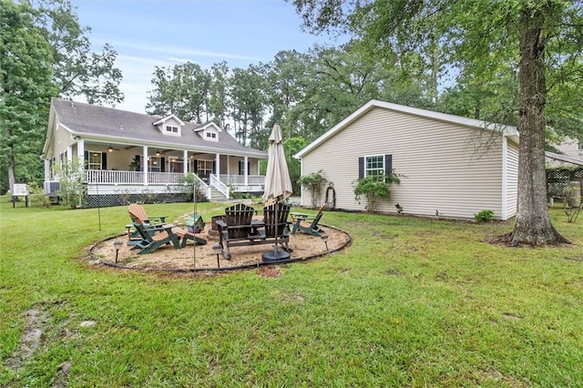 28 Hyacinth Dr, Covington, LA 70433 - rear view of house with a ceiling fan, an outdoor fire pit, and a yard