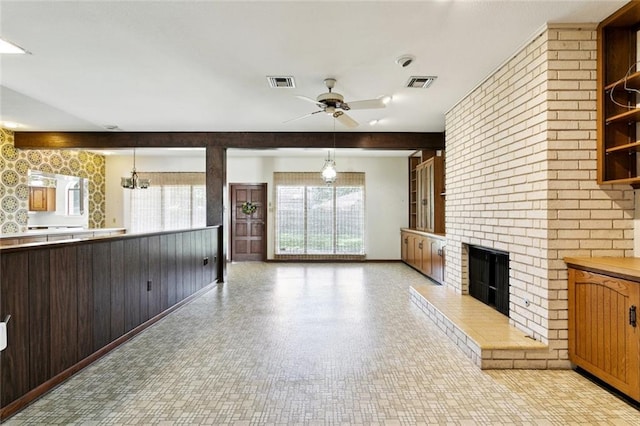 3709 Metairie Hts, Metairie, LA 70002 - unfurnished living room featuring a ceiling fan and a brick fireplace