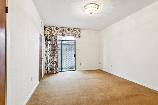 3709 Metairie Hts, Metairie, LA 70002 - carpeted spare room featuring a textured ceiling and baseboards