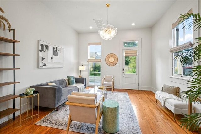 3311 Saint Ann St, New Orleans, LA 70119 - living room featuring a chandelier, hardwood / wood-style floors, and recessed lighting