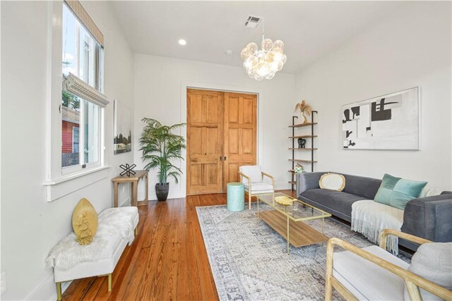 3311 Saint Ann St, New Orleans, LA 70119 - living area featuring a chandelier, wood finished floors, and recessed lighting
